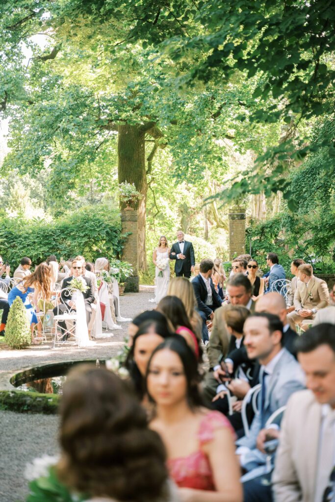 garden party wedding in Italy with greenery and white flowers