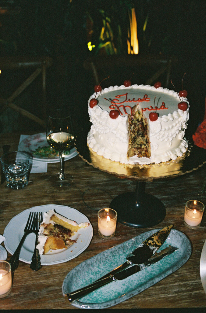 vintage "Just Married" white wedding cake with cherries