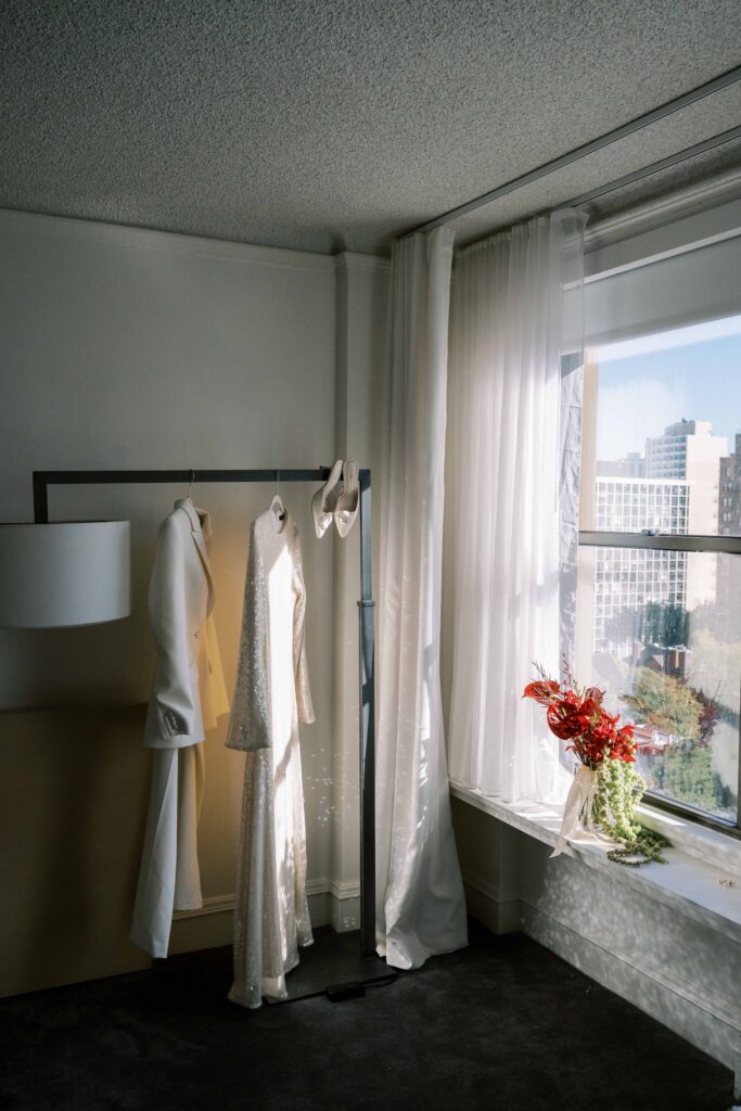 white wedding pant suit for bride; outfit change for wedding; sparkly wedding reception dress