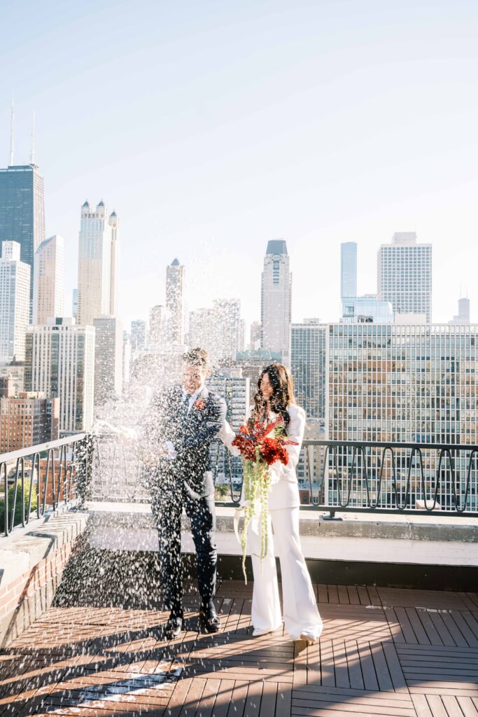 first look with champagne pop; champagne toast first look