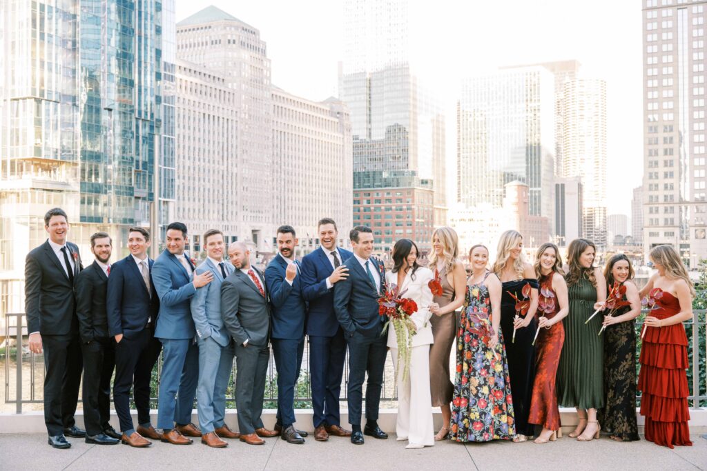 wedding party wearing mix-and-match bridesmaids dresses and groomsmen suits