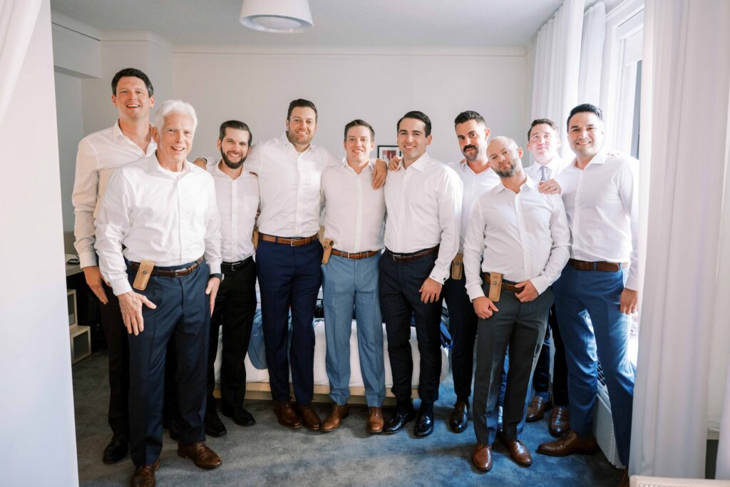 wedding party groomsmen getting ready