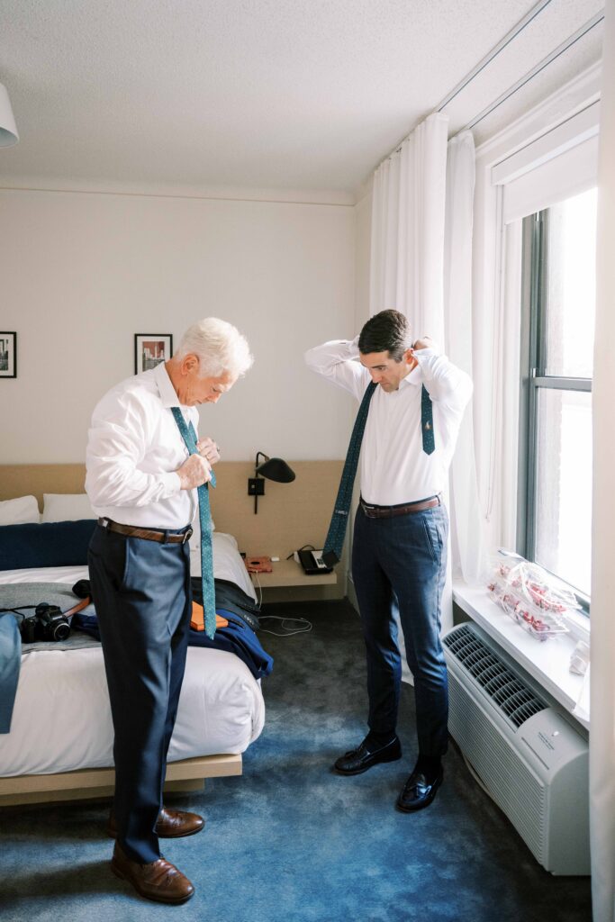 groom and father getting ready on wedding day