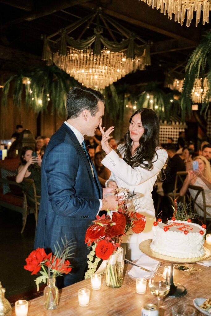 bride and groom sharing wedding cake