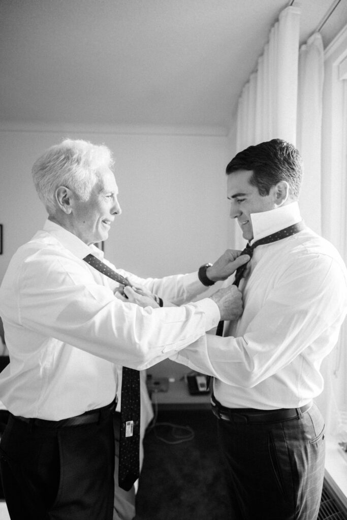 groom and father getting ready on wedding day