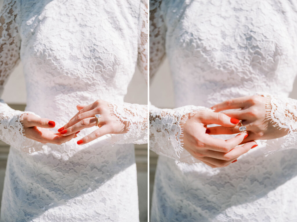 bride in white lace gown, red nails, and engagement ring. 