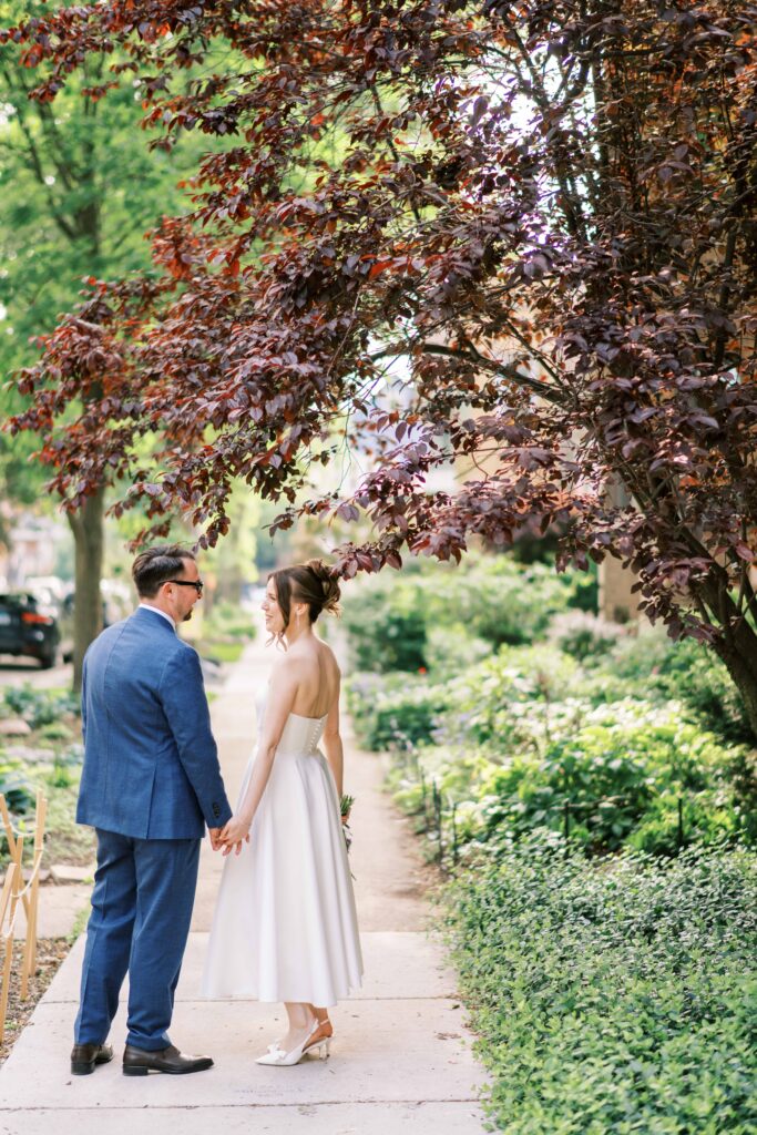 candid portraits of bride and groom walking