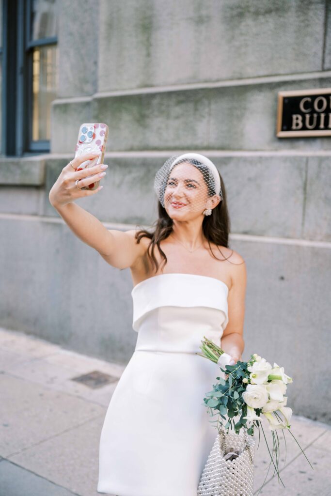 photo of bride taking selfie