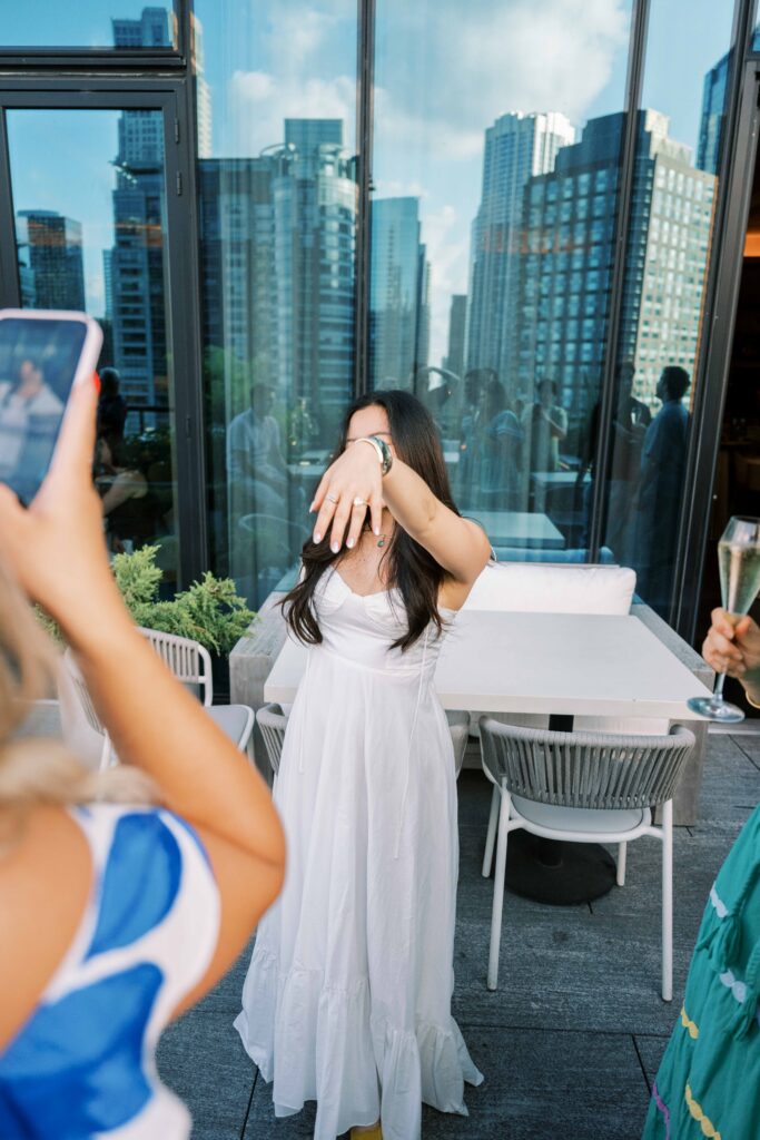 showing off engagement ring after proposal