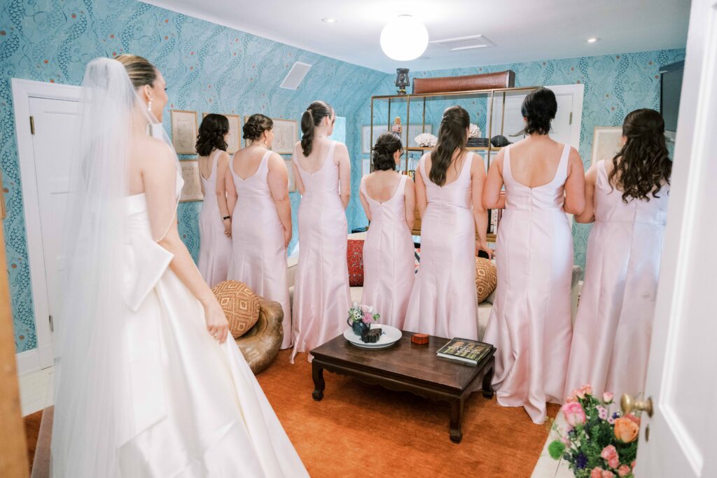 bride's first look with bridesmaids
