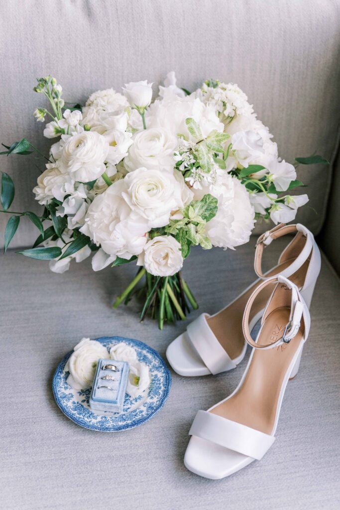 all white bridal bouquet with different types of flowers