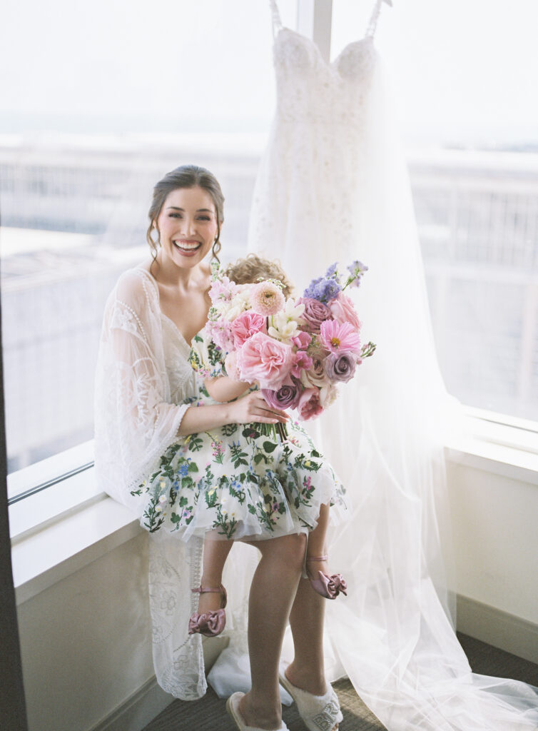 bride and flower girl getting ready