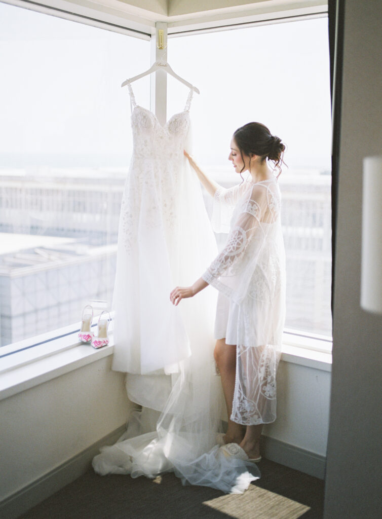 bride getting ready; photos with dress