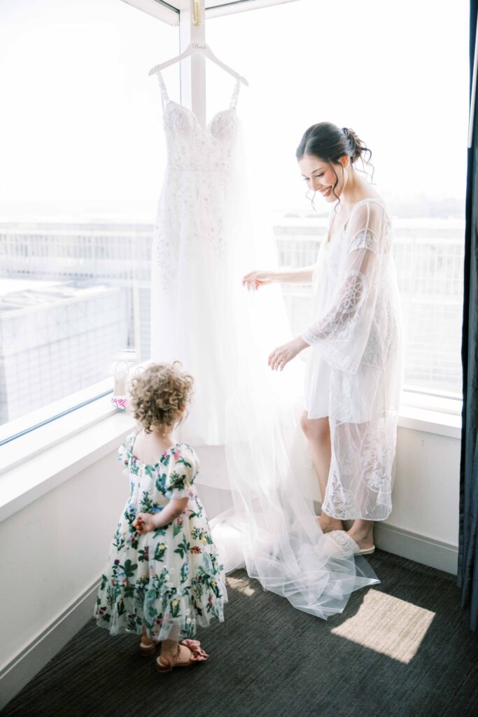 bride and flower girl getting ready